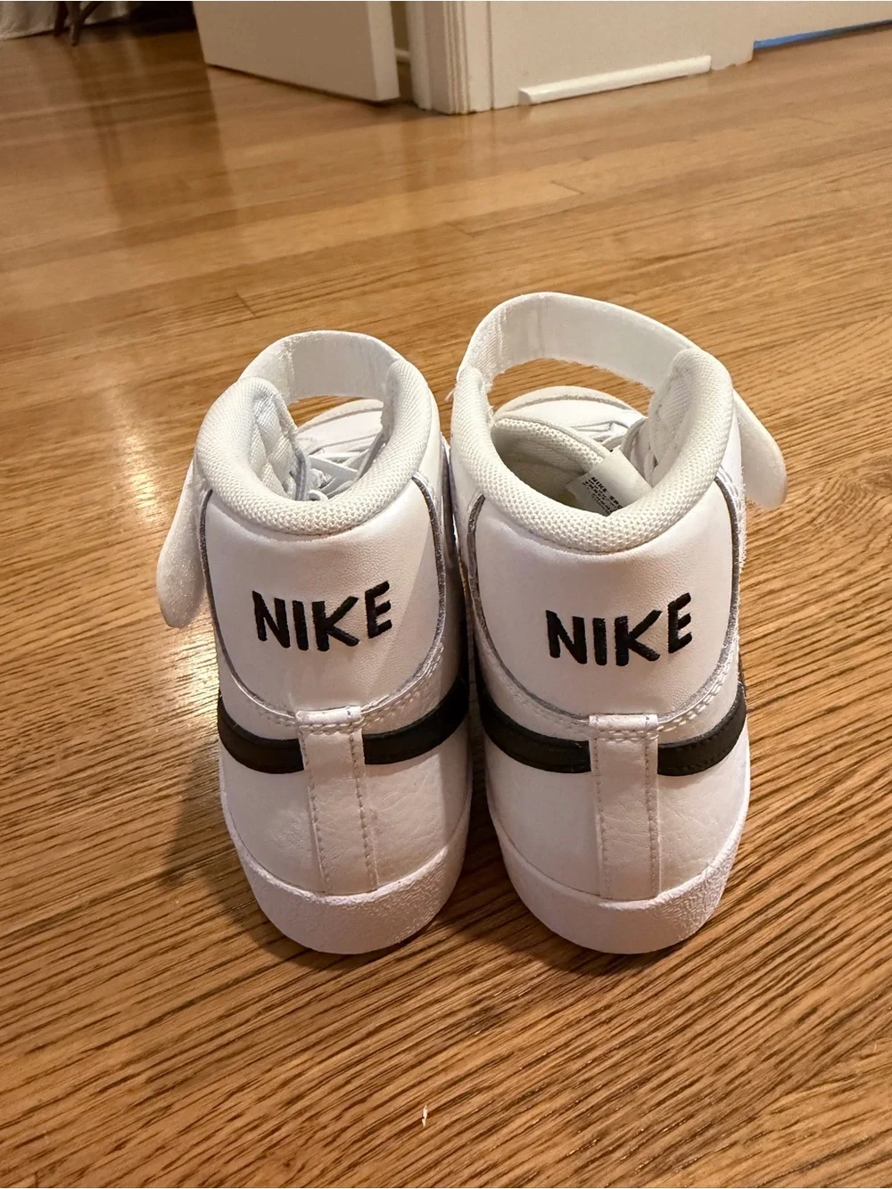 Nike Kids White High-Top Sneakers with Black Swoosh